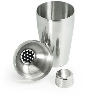 May include: A stainless steel cocktail shaker with a strainer lid and a separate cap. The shaker has a smooth, polished finish.