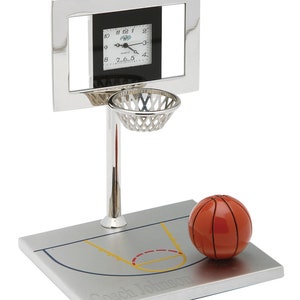May include: Silver basketball hoop desk clock with a basketball on a gray base with a basketball court design and the text "Coach Johnson".