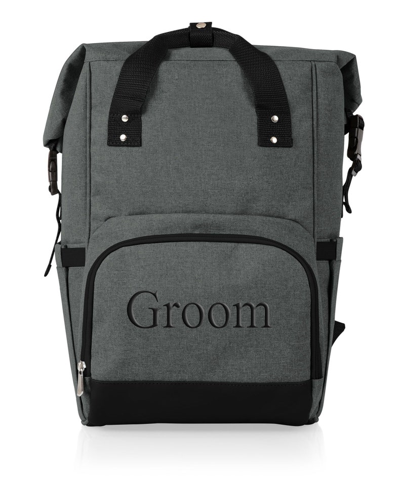 May include: Gray insulated backpack with black straps and a zippered front pocket. The front pocket has the word "Groom" embroidered in black.