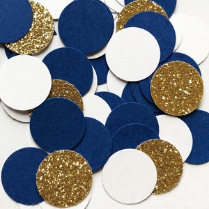 May include: Assortment of blue, white, and gold confetti circles. The circles are made of paper and have a glitter finish.