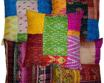 May include: A collection of colorful patchwork throw pillows. Each pillow features a unique design with a variety of colors including blue, yellow, green, pink, and red. The pillows have a textured appearance and are likely made of fabric.