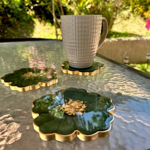 Handmade Forest Olive Green and Gold Flower Shaped Coasters Set - Jasmin Renee Art - Three Coasters and Cup on Table Outdoors