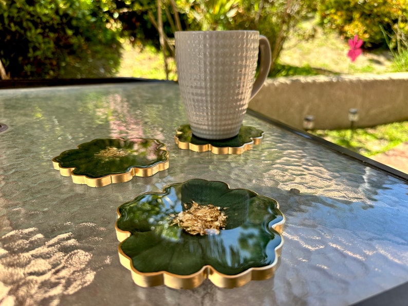 Handmade Forest Olive Green and Gold Flower Shaped Coasters Set - Jasmin Renee Art - Three Coasters and Cup on Table Outdoors