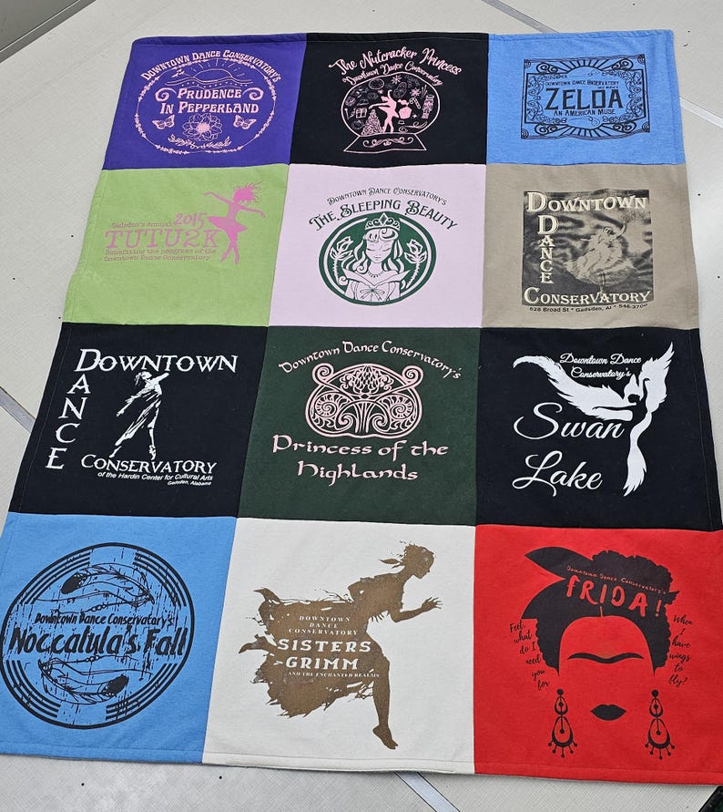 May include: A quilt made of 10 different t-shirts, each with a unique design and text. The designs include a ballerina, a princess, a swan, a sleeping beauty, and a Frida Kahlo portrait. The text includes "Downtown Dance Conservatory", "The Nutcracker Princess", "Zelda", "Tutu", "Swan Lake", "Princess of the Highlands", "Noccalula's Fall", "Sisters Grimm", and "Frida!"