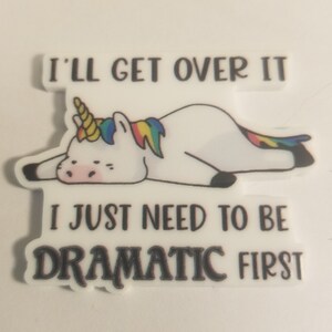 May include: A white unicorn with a rainbow mane and tail is lying down with its eyes closed. The text "I'll get over it I just need to be dramatic first" is written below the unicorn.