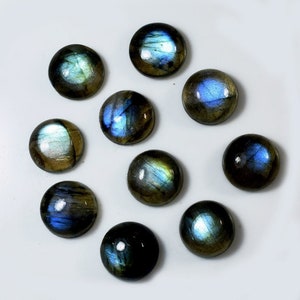 May include: Ten round, iridescent labradorite cabochons in shades of blue, green, and gold. The cabochons are smooth and polished, with a high gloss finish.