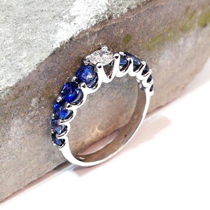Sapphire and diamond eternity band, shared prong wedding band