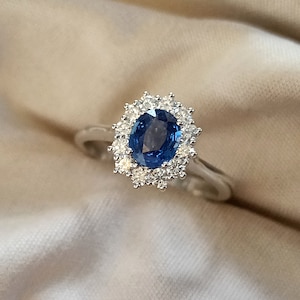 Oval sapphire halo engagement ring, daisy ring, Diana ring.