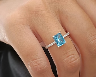 Blue Topaz emerald cut engagement ring in 18k white Gold, side Diamonds ring