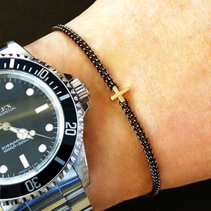 Kruisarmband. Herenarmband van 18 karaat goud.
