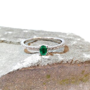 Emerald and diamond ring. Emerald engagement ring