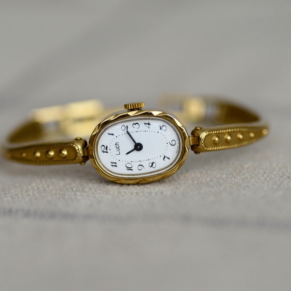 Vintage Dainty wristwatch with gilded bracelet. Women's evening watch. Cocktail watch with an oval dial
