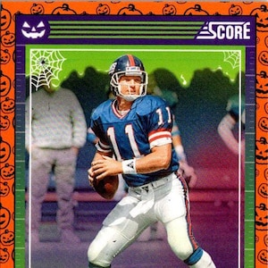 Phil Simms n° 215 des Giants de New York ; citrouilles oranges ; Ballon de football pour un match Panini 2024