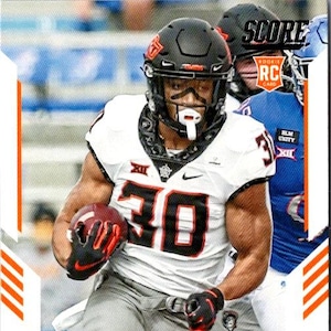 May include: A football trading card featuring a player in a white and black uniform with the number 30. The player is wearing a black helmet and holding a football. The card has the text "CHUBA HUBBARD" and "COWBOYS".