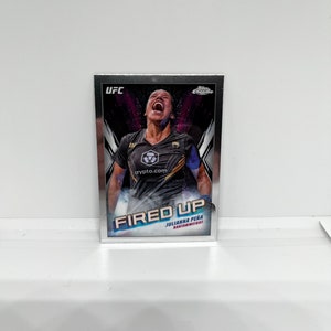 May include: A UFC trading card with a silver border, featuring Julianna Peña. The card shows Peña with the text "FIRED UP" and "BANTAMWEIGHT". The UFC and Topps Chrome logos are also visible on the card.