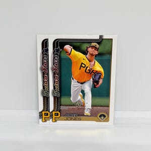 May include: Two baseball trading cards featuring a player in a yellow and black uniform. The cards have the text "Future Stars" and "PP" on them. The player is identified as Jared Jones.