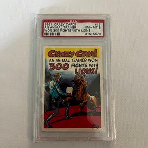 Un Entrenador de Animales #19 PSA 8; ganó 300 peleas con leones; Topps cartas locas 1961