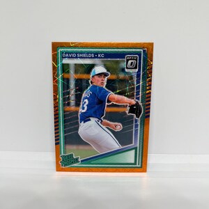 David Shields #104 Kansas City Royals; Rated Prospect - Optic Orange Velocity Prizm; Panini Donruss Baseball 2025