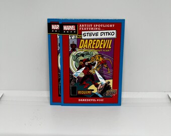 Artista in primo piano con #ASF10; Steve Ditko - Daredevil #162; Ponte superiore Marvel Ages 2020