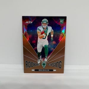 Braelon Allen #RRBAN New York Jets; Rookie Rising inzetstuk: brons, parallel genummerd 15/75; Panini Phoenix Football 2024