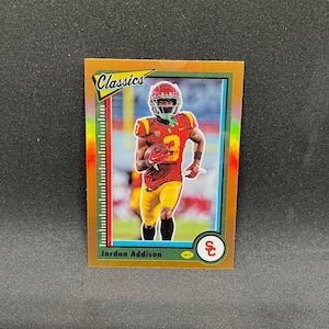 Jordan Addison #7 Minnesota Vikings; The Classics - Naranja SP; Selecciones del Draft de Fútbol Americano de Panini Chronicles 2023