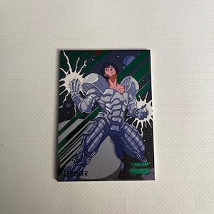 May include: A trading card featuring a comic book character, the Beyonder, in a silver and black suit with green accents. The card is from the 2022 Fleer Ultra Avengers set.