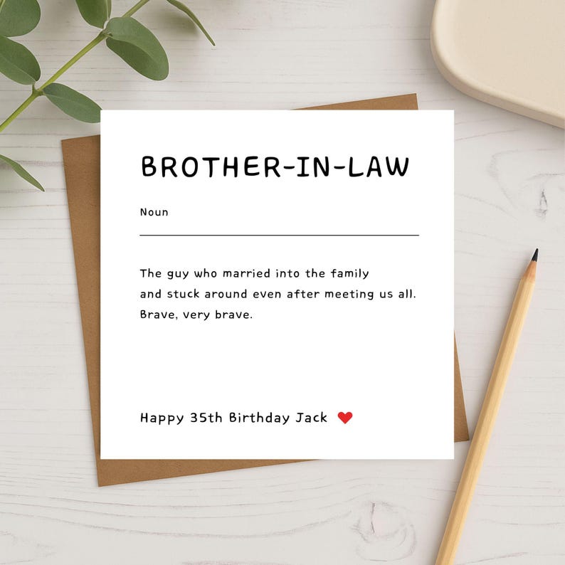 Flat-lay image of a square brother-in-law birthday card on a brown envelope with a pencil and green leaves. The card features a witty definition-style message about a brother-in-law’s bravery for joining the family, customised with “Happy 35th Birthday Jack ❤️” at the bottom.