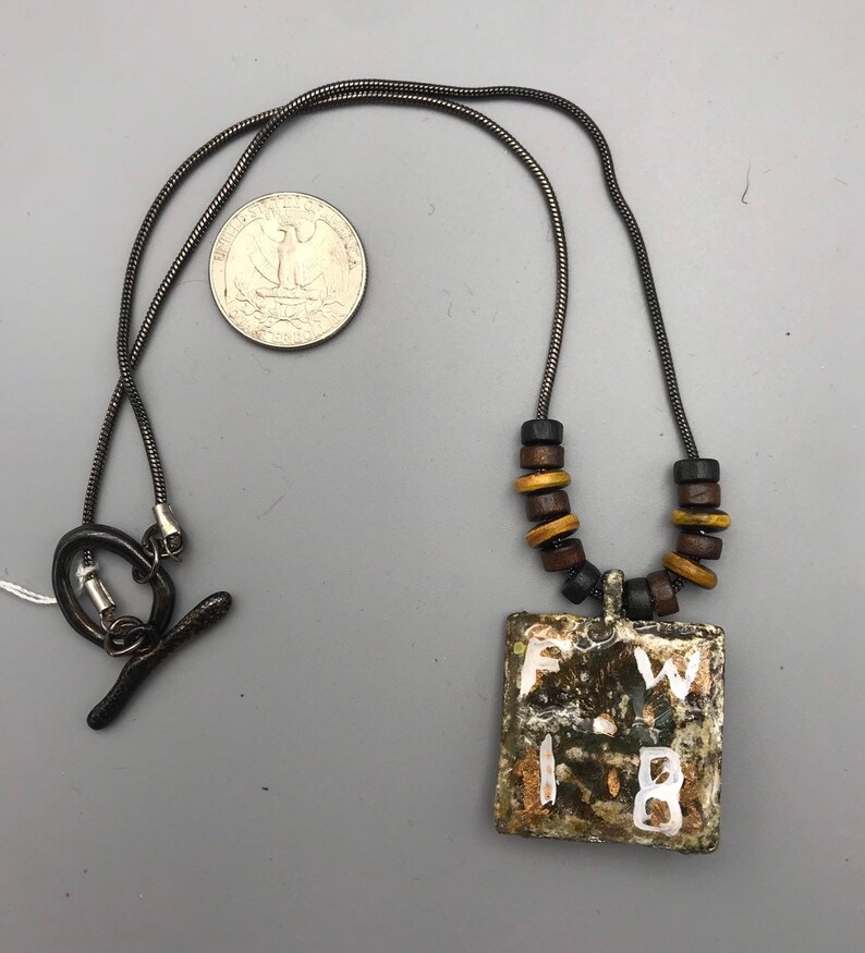 Mr Happy Go Lucky is a smiley pendant on a lead free chain necklace