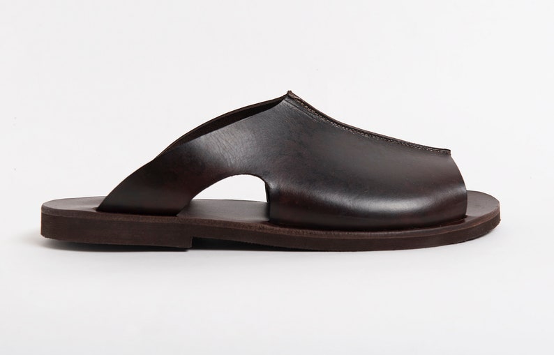 May include: A set of three ceramic mugs with a speckled, matte finish. The mugs are in shades of cream, light gray, and dark gray. Each mug has a simple, minimalist design, perfect for coffee or tea.