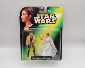 Figura de acción de la Princesa Leia y Luke Skywalker de la colección Princesa Leia de Star Wars de Kenner Hasbro de 1997.