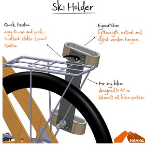May include: A wooden ski holder attached to a bike rack. The holder has a quick-release mechanism and is designed to fit on most bike porters. The text "Ski Holder" is written at the top of the image.