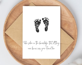 May include: A white card with black footprints and the text "Take solace in the knowledge. That all they ever knew was your eternal love."