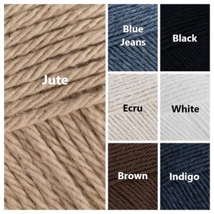 May include: A close-up of a beige jute yarn skein. The yarn is arranged in a spiral pattern. The image also shows swatches of other yarn colors: blue jeans, black, ecru, white, brown, and indigo.