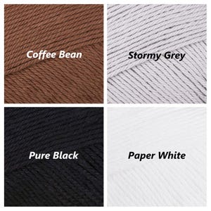 May include: Four yarn skeins in different colours: Coffee Bean, Stormy Grey, Pure Black, and Paper White.