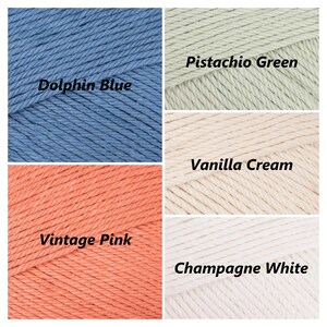 May include: Four yarn skeins in different colours: dolphin blue, pistachio green, vanilla cream, and vintage pink. The yarn is a soft, cotton blend.