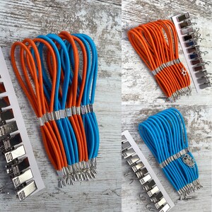 Set med 12 sidospännare för broderiramar. Produktens längd är 12 cm (4,72 tum)