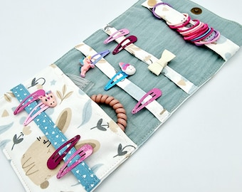 Pochette à barrettes et chouchous élastiques prêtes à partir