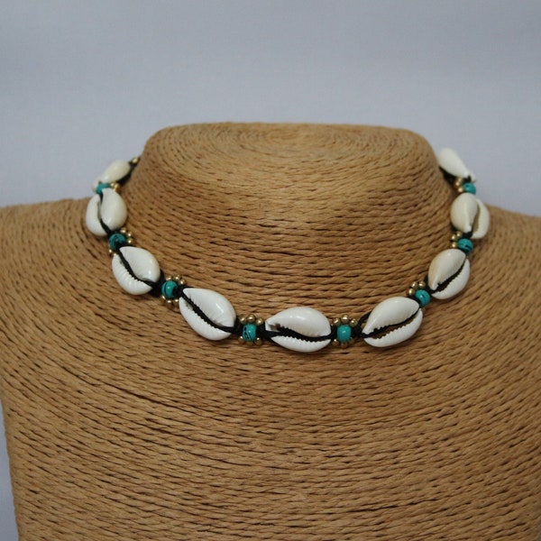 Cowrie Shell Choker on black cord with turquoise coloured bead and brass beading