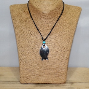 Cute chunky and solid aluminium fish pendant set with stainless steel bead hung on adjustable vegan wax cord.