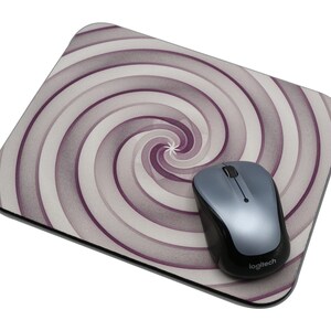 May include: A purple and white swirl patterned mouse pad with a silver Logitech mouse on top.