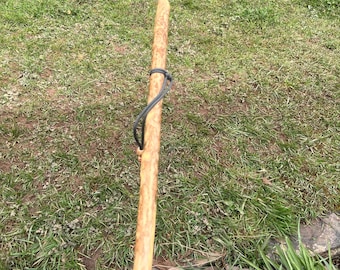 Rustic Holly hiking stick. Very straight 46” stick with useful paracord wriststrap that complements the natural light patina. Rubber ferrule