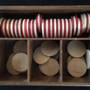 Vintage Wooden Box Full of 65 Vintage Flat Wooden (Probably Birch) Checkers, 43 with Natural Finish, 22 Painted Red