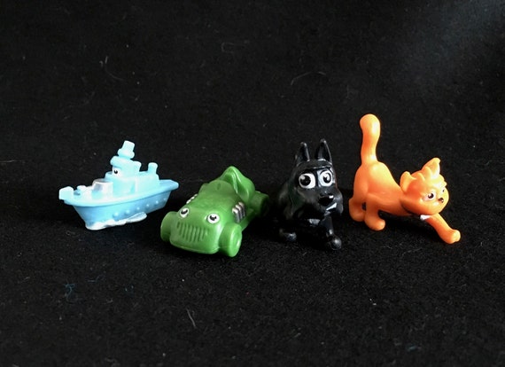 Four Fanciful Plastic Playing Pieces from the Monopoly Jr. Game -- Colorful, Anthropomorphic Boat, Racecar, Cat and Dog