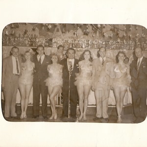 Vintage Candid 1953 Photograph of Businessmen Posing with Scantily-Clad Waitresses at the Paris Inn Restaurant in Beverly Hills, California