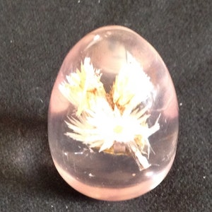 White Flowers Embedded in an Acrylic Egg Paperweight