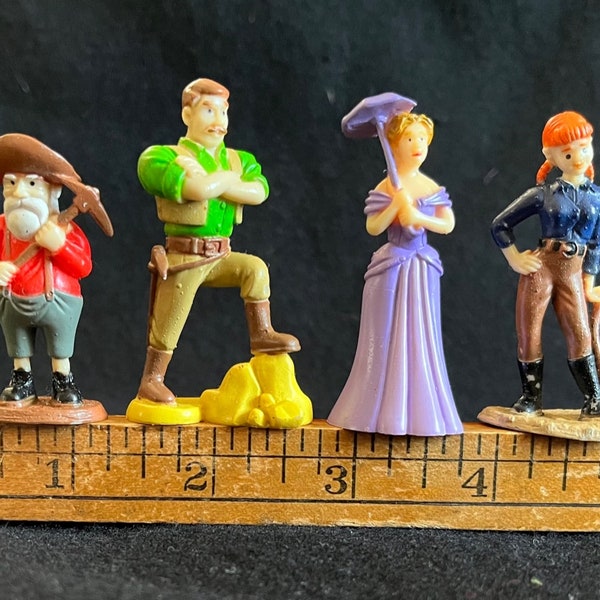 Four PVC Action Figures/Playing Tokens from an Old West-Themed Prospecting Game