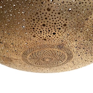 Moroccan Brass Lantern Chandelier with Stunning Light Pattern
Bring the magic of Marrakesh into your home with this magnificent, handcrafted Moroccan Brass Pendant Light. Known for its exquisite craftsmanship, this lamp is meticulously hand-punched, allowing light to filter through a myriad of small perforations to cast an immersive, spectacular, starburst pattern of light and shadow on your walls and ceiling.
