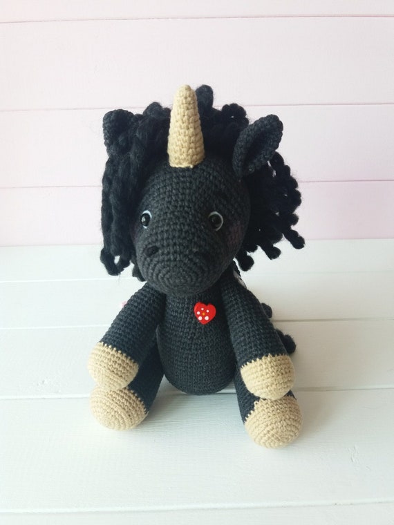 black stuffed unicorn