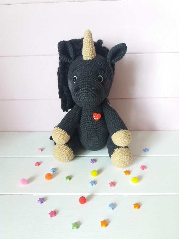 black stuffed unicorn