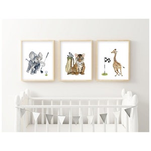 May include: Three watercolor paintings of animals playing golf. A grey elephant swings a golf club, a tiger holds a golf bag, and a giraffe stands by a golf flag.